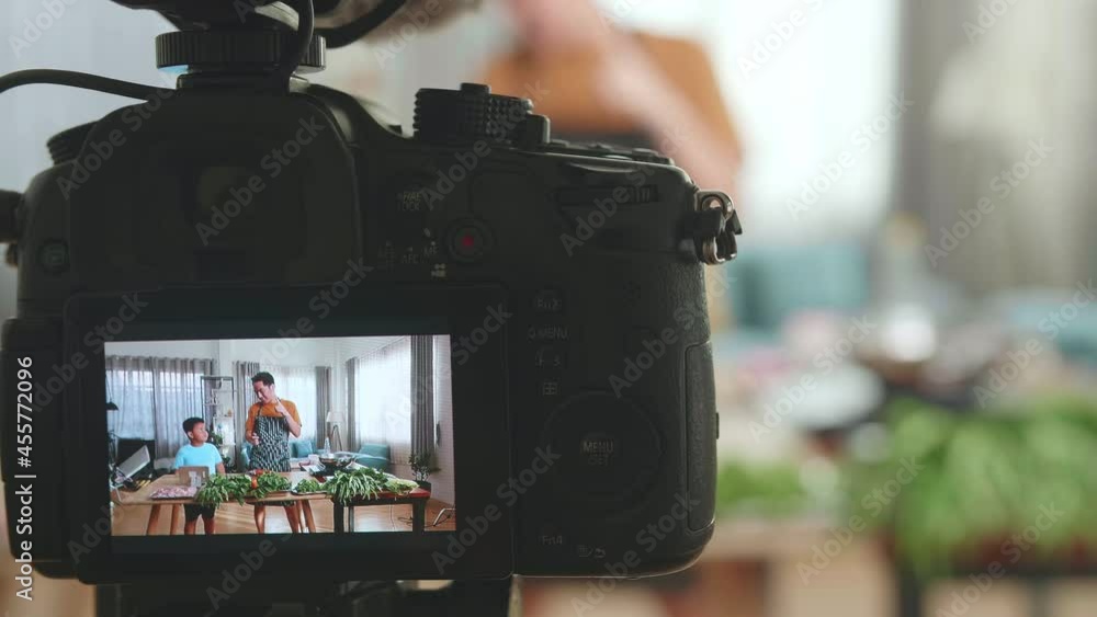 Display Camera Of Asian Father And Son Streaming Live Video With Camera To Share Online While Cooking At Home, Food Tasting And Thumbs Up
Display Camera Of Asian Father And Son Streaming Live Video With Camera To Share Online While Cooking At Home, Food Tasting And Thumbs Up