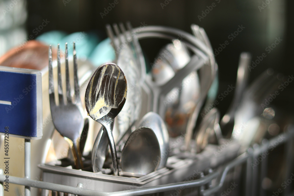 Dirty dishes before washing in the dishwasher