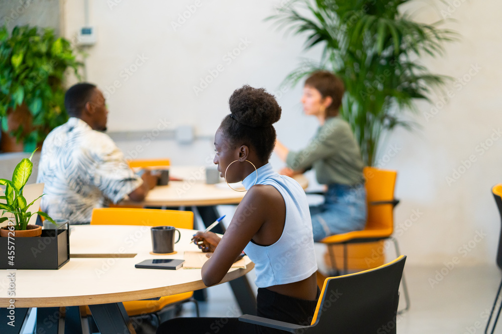 Colleagues In A Coworking Workplace. Colleagues In A Coworking Workplace.