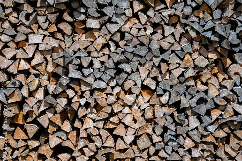 Background of dry chopped firewood logs in a pile Background of dry chopped firewood logs in a pile