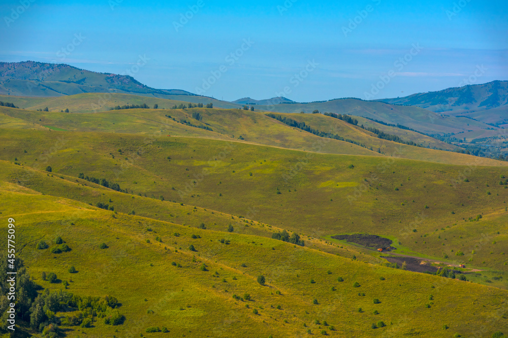 Summer landscape with hills and mountains of the Altai. Summer landscape with hills and mountains of the Altai.