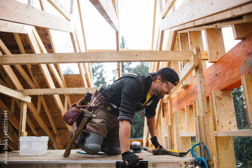 Carpenter working on the job site in winter