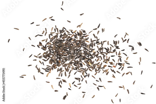Pile bird niger seed (Guizotia abyssinica) isolated on white background, top view