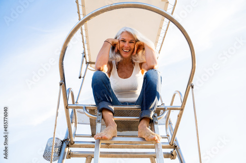 Active mature woman enjoying at beach
