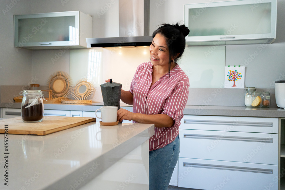 Asian woman serving coffee at modern kitchen Asian woman serving coffee at modern kitchen