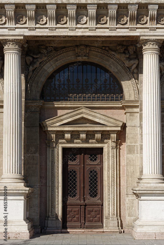 Doors of an old stone building with high columns on the sides. From a series of doors of the World.