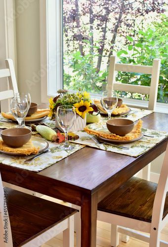 Autumn Thanksgiving table decor and place settings for festive family dinner, home life interior background. Copy space, house and home background, living