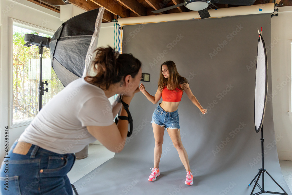 © Jayme Burrows/Stocksy - Model Poses for Photoshoot on Backdrop