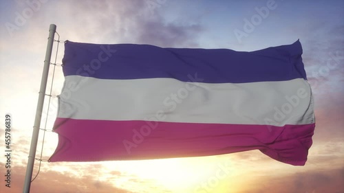 Heterosexual pride flag waving in the wind, sky and sun background