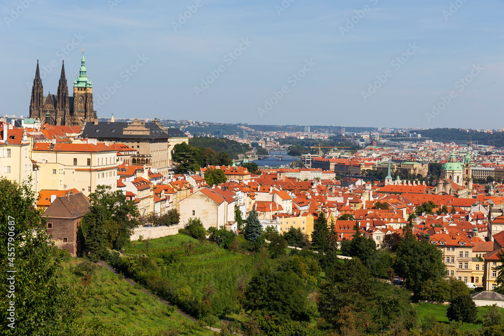 Autumn Prague City with gothic Castle and the colorful Nature with Trees from the Hill Petrin, Czech Republic