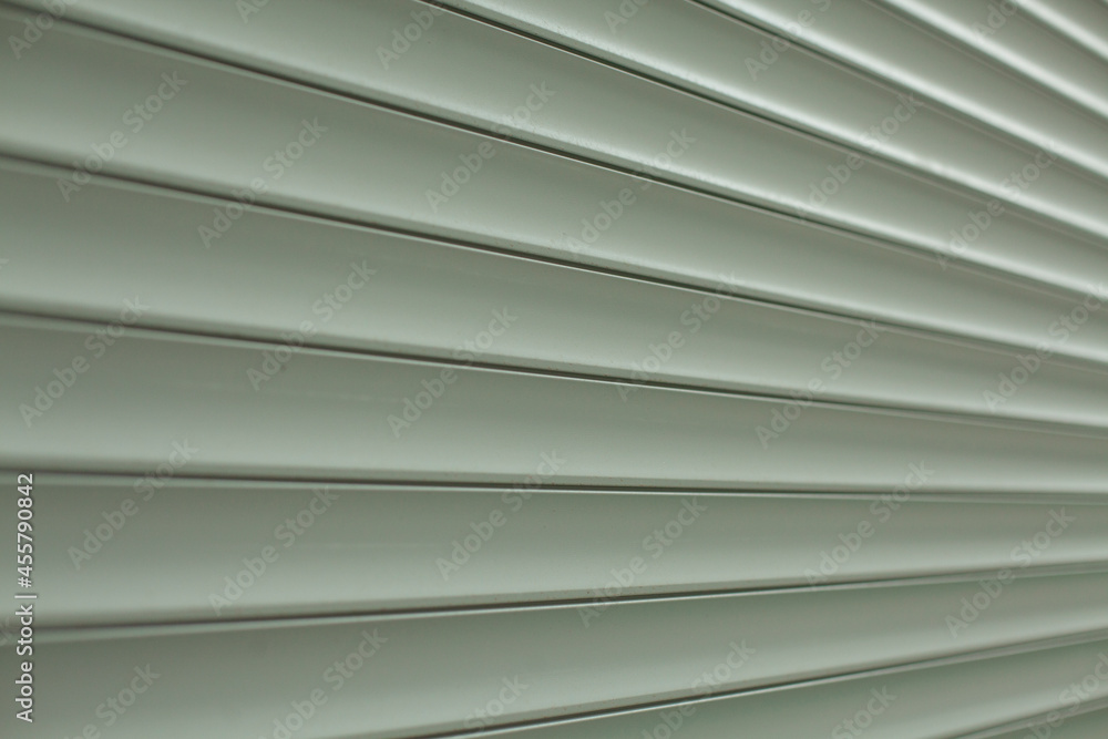 Obraz premium Blinds texture on the street. Plastic surface covering the windows.