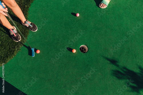 Putters on the fairway at the golf course.  photo