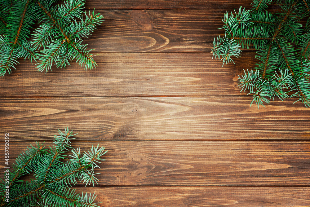 Fir branches on a wooden rustic background. Fir branches on a wooden rustic background.