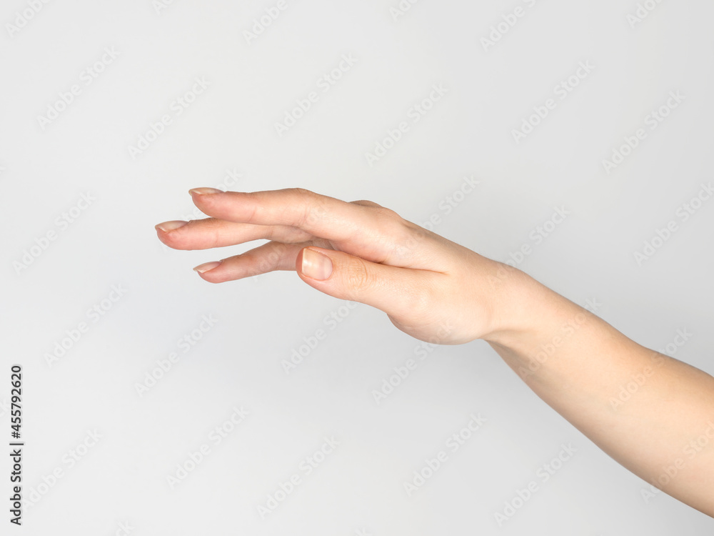 Female hand on empty white background Female hand on empty white background
