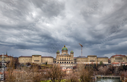 View of the complex of buildings of the Swiss Parliament shot from the Monbijou bridge over the Aare river photo