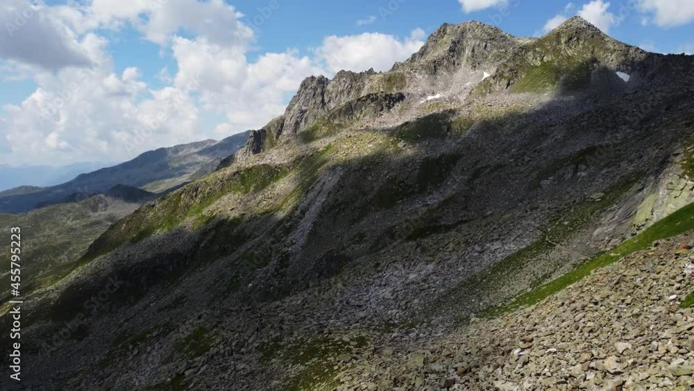 Green and stony mountains in the Alps Green and stony mountains in the Alps
