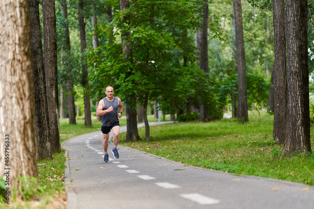 Marathon runner training in the park