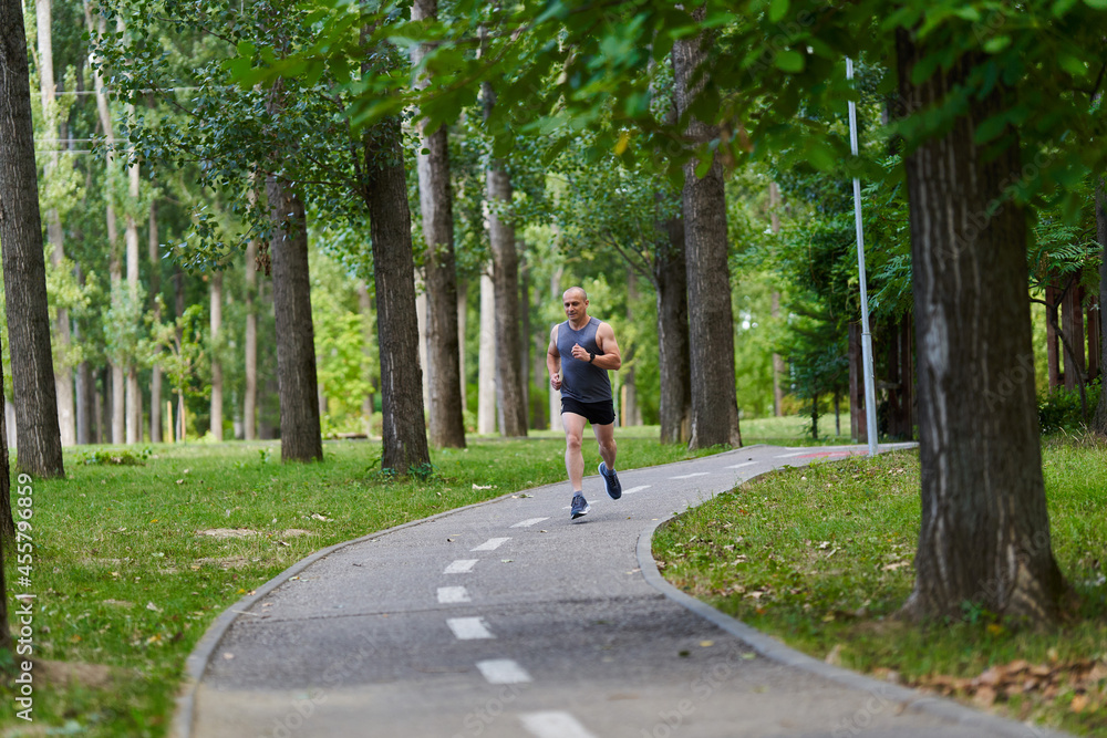 Marathon runner training in the park Marathon runner training in the park