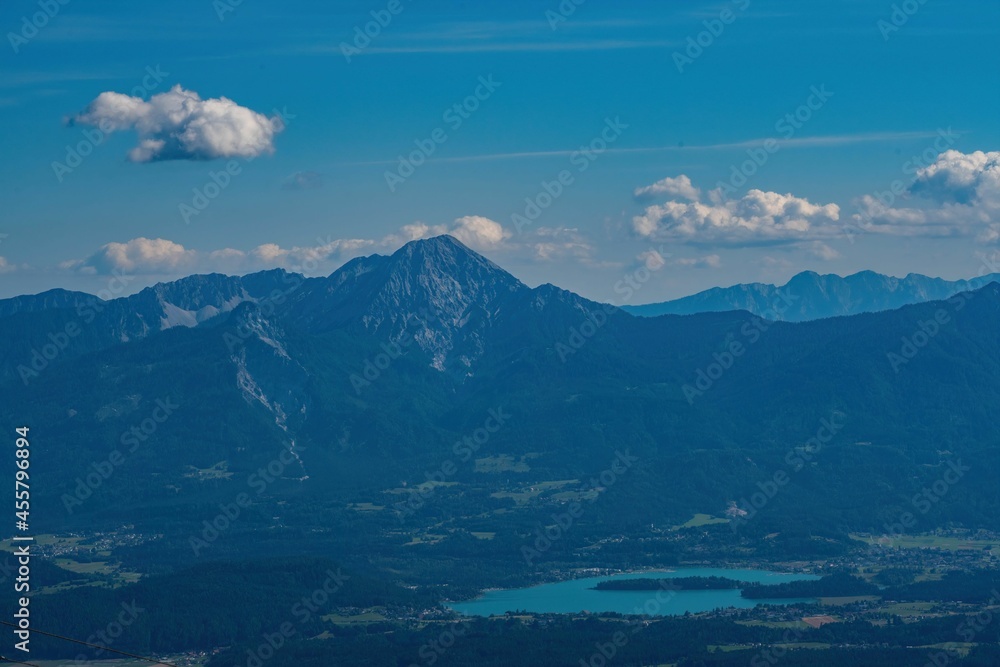 view at the region of Villach in Carinthia with lake Faak and the Karawank mountains in the distance seen from Mount Gerlitzen