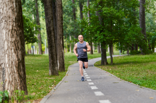 Wallpaper Mural Marathon runner training in the park Torontodigital.ca