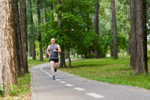 Wallpaper Mural Marathon runner training in the park Torontodigital.ca