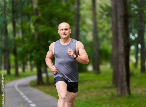 Marathon runner training in the park