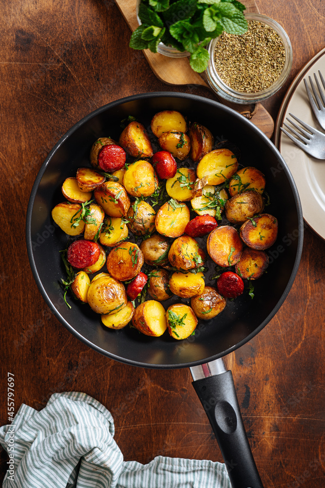 Pan win fried potatoes and fried sausages Pan win fried potatoes and fried sausages