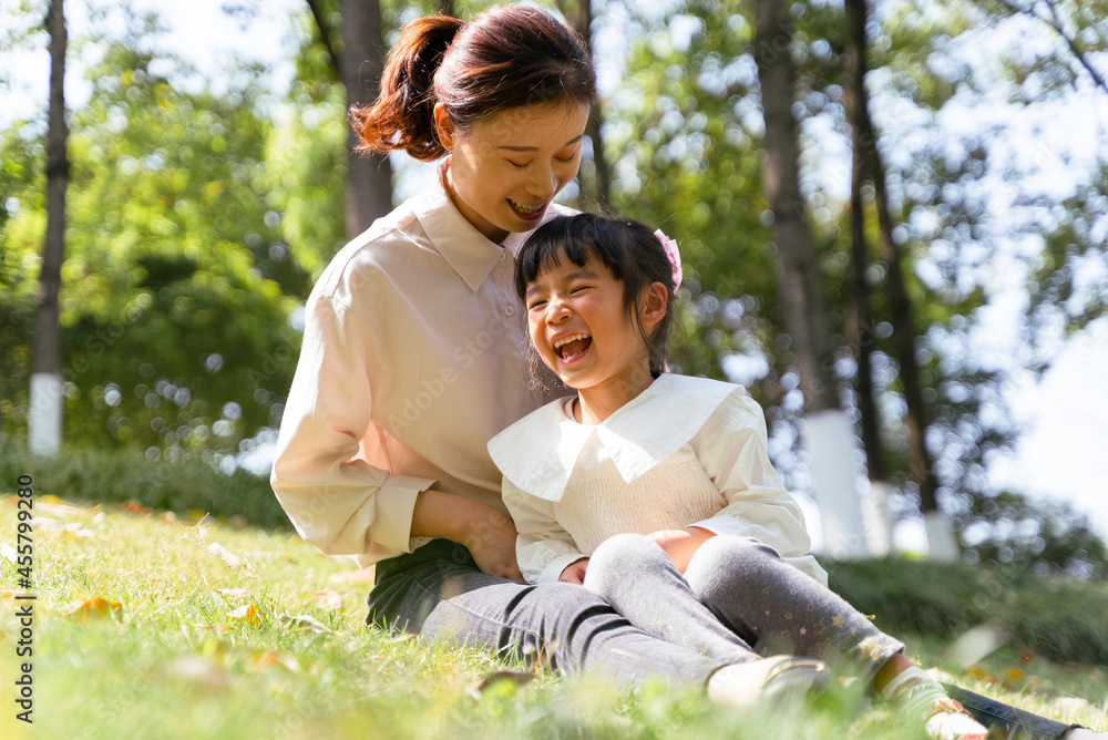 happy asian kid with mother in the park happy asian kid with mother in the park