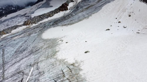 Overview of a large glacier on a mountain slope in the alps