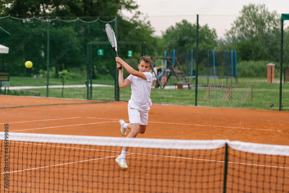 Young tennis player on the outdoor court. Young tennis player on the outdoor court.