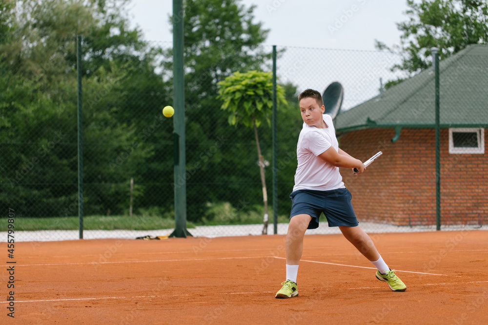 Young tennis player on the outdoor court. Young tennis player on the outdoor court.