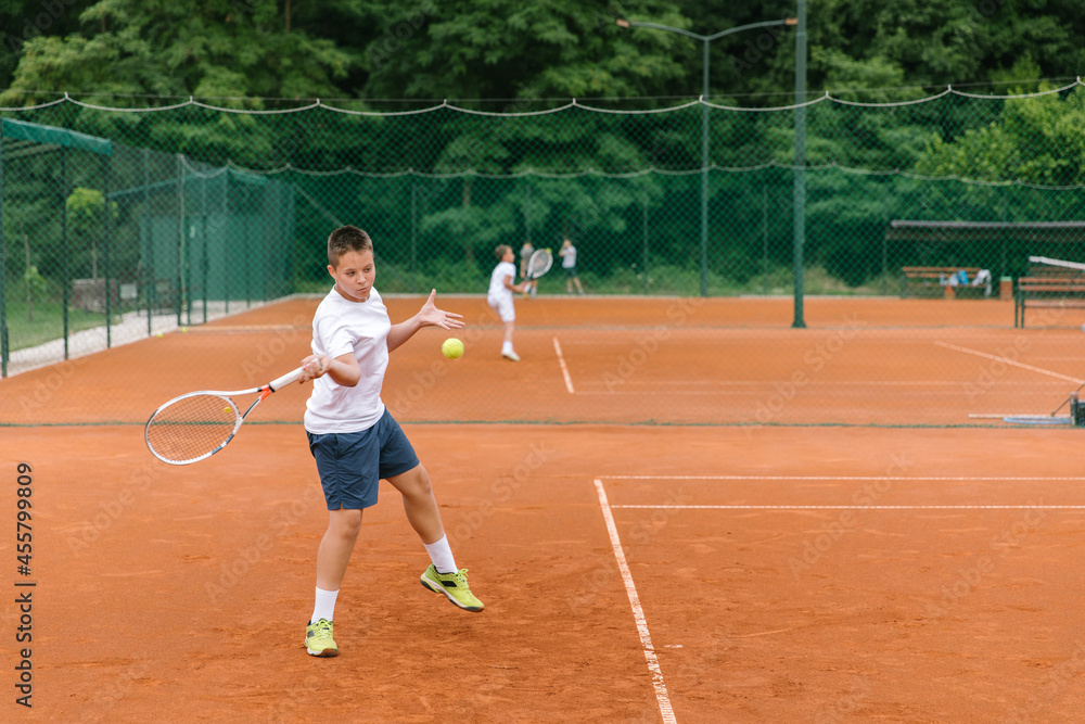 Young tennis player on the outdoor court. Young tennis player on the outdoor court.