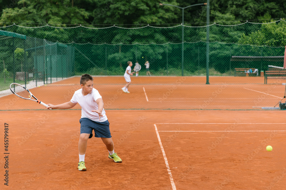 Young tennis player on the outdoor court. Young tennis player on the outdoor court.