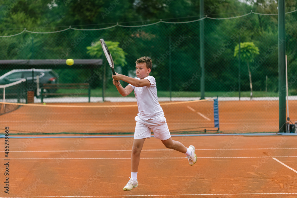 Young tennis player on the outdoor court. Young tennis player on the outdoor court.
