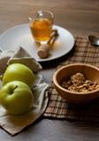 Eat the day with a healthy breakfast of honey muesli and apples
