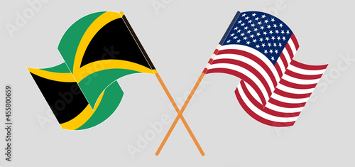 Crossed and waving flags of Jamaica and the USA