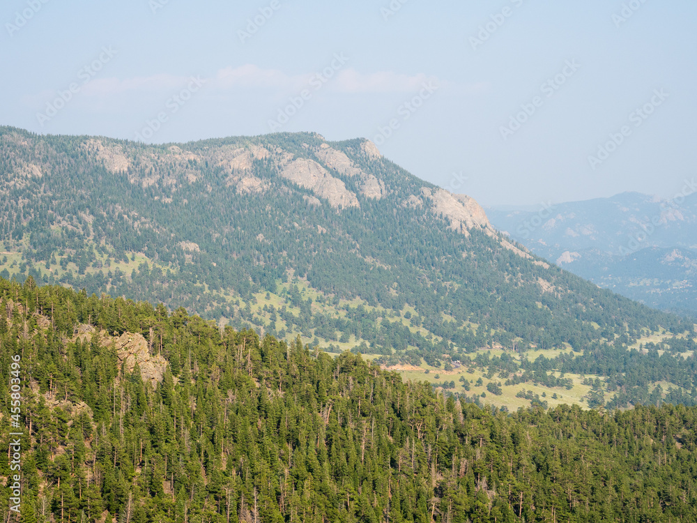 Colorful Colorado's pine forest and rolling mountains.