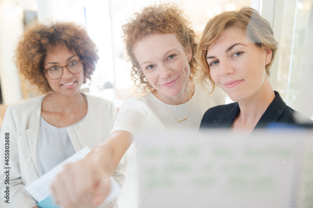 Three office workers talking at office Three office workers talking at office