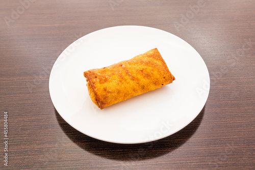 Crispy Chinese spring roll stuffed with vegetables and meat popular in Chinese restaurants