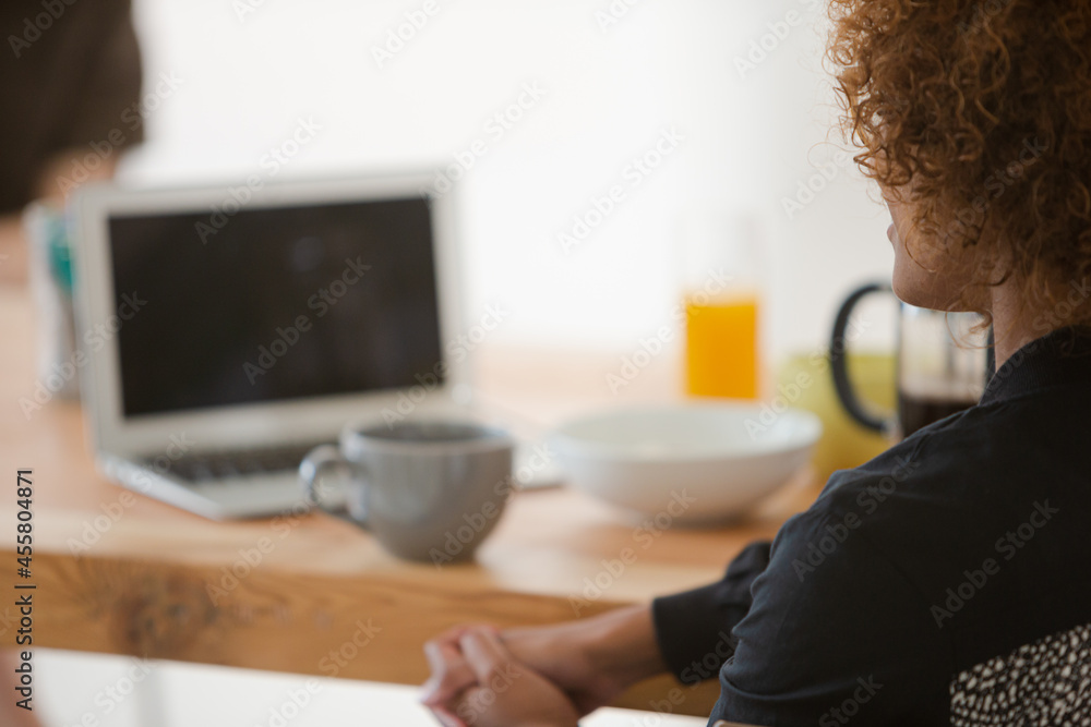 Womnan sitting at desk with coffee cup Womnan sitting at desk with coffee cup