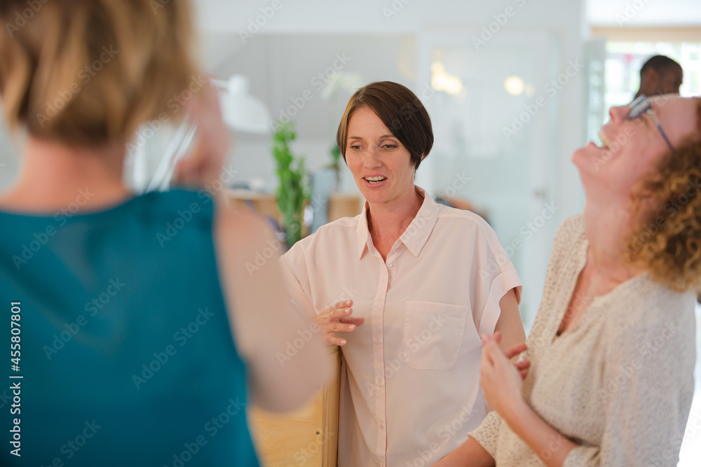 Group of smiling women at work Group of smiling women at work