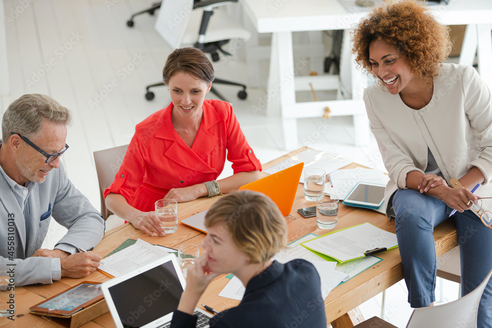 Office workers having meeting at desk Office workers having meeting at desk
