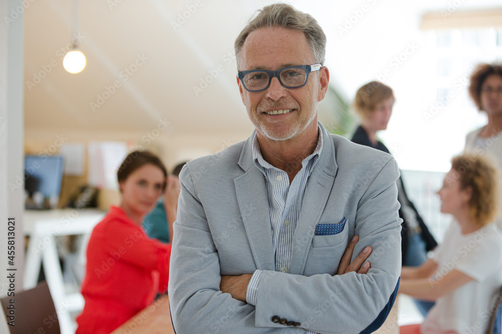 Portrait of businessman smiling in office