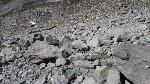 Mountain and glacier  drone shot in the alps, introduced with a pan up