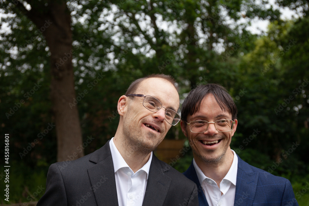 Two happy well-dressed friends with down syndrome. Two happy well-dressed friends with down syndrome.
