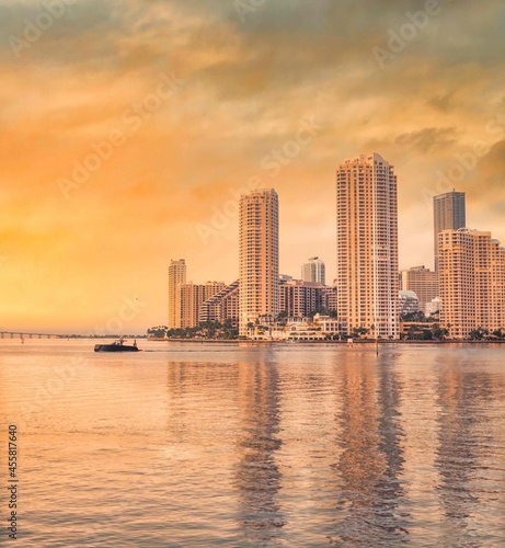 Miami Florida sea reflections buildings boat skyscrapers city skyline at sunset urban panorama 