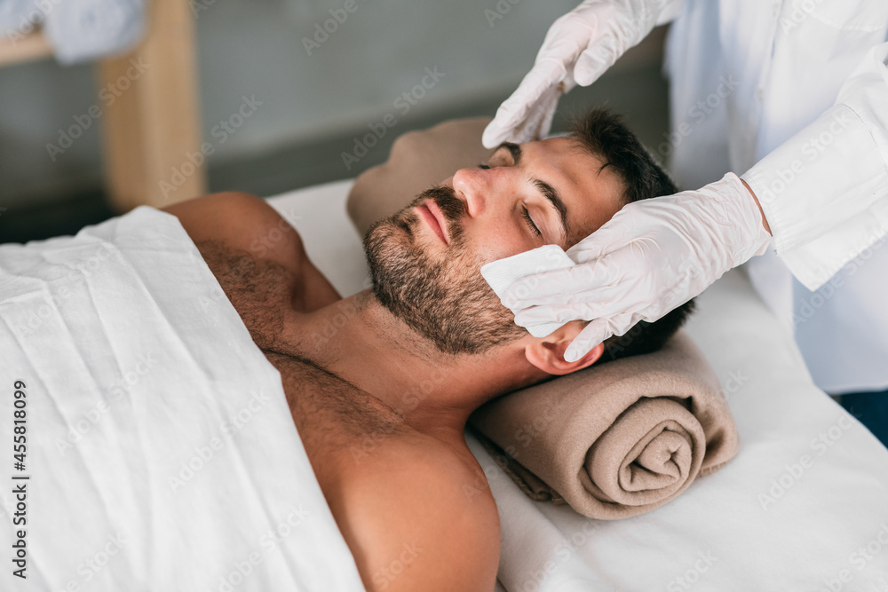Man on Cosmetic Treatment in Beauty Salon Man on Cosmetic Treatment in Beauty Salon