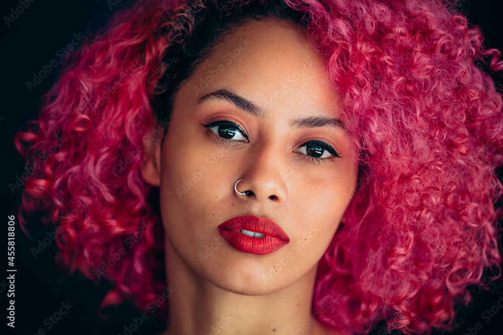 Cool woman with pink hair look at the camera Cool woman with pink hair look at the camera