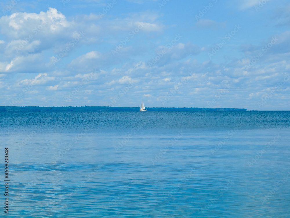Summer by the beach of lake and sailboat. Summer by the beach of lake and sailboat.
