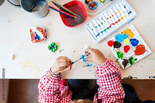 kid painting at home photo